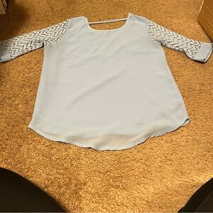 Blue 3/4 Sleeve Blouse with Lace Detail on the arms and a cut out on the back